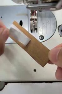 Insert the fabric piece by folding the edge inward.